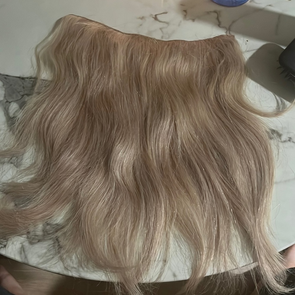 Lightly worn blonde layered halocouture halo hair extensions in f116